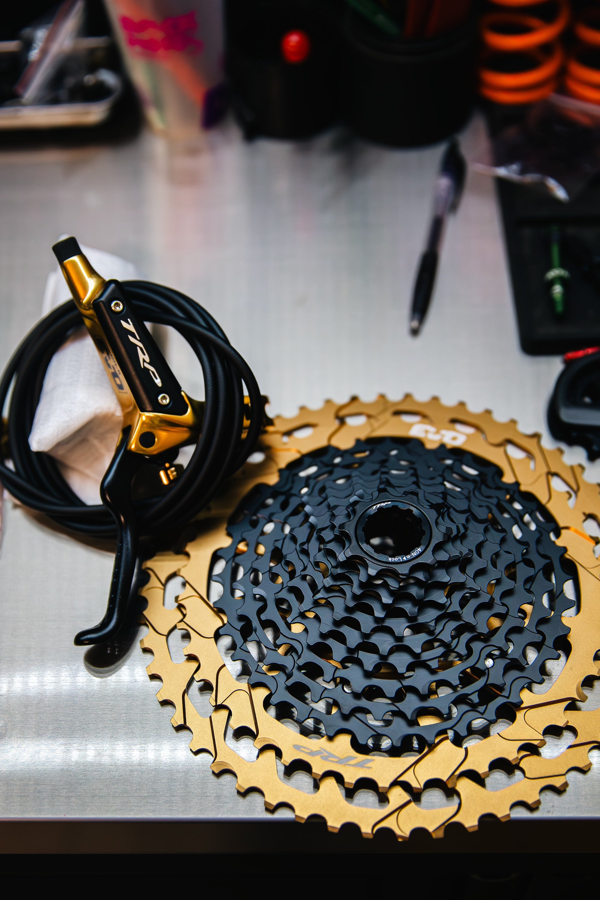 close-up of MTB  TRP lever and cassette in gold
