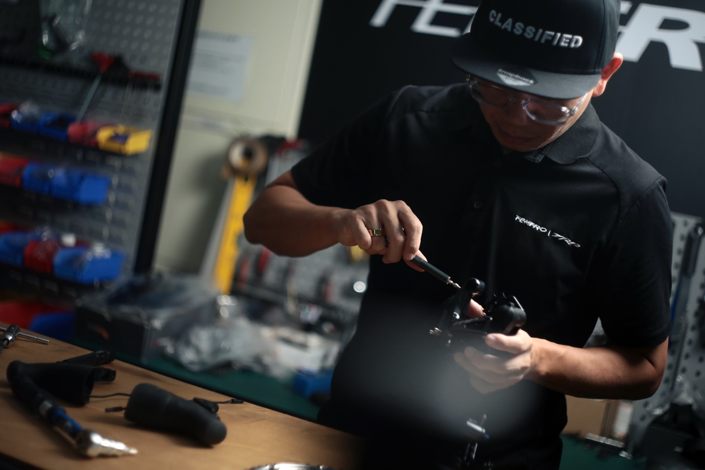 Person adjusting the Vistar derailleur in a work shop setting