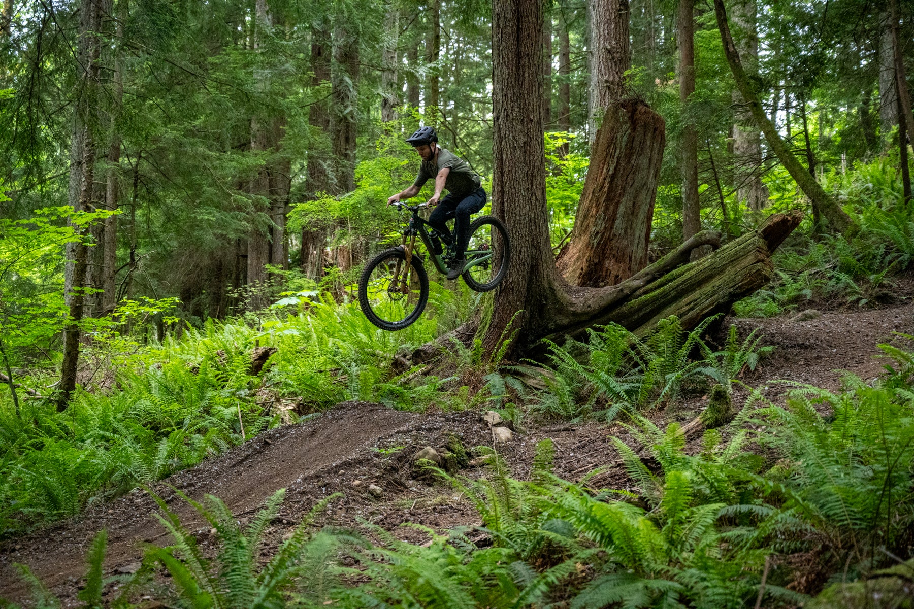 man jumping with bike downhill with TRP EVO 12