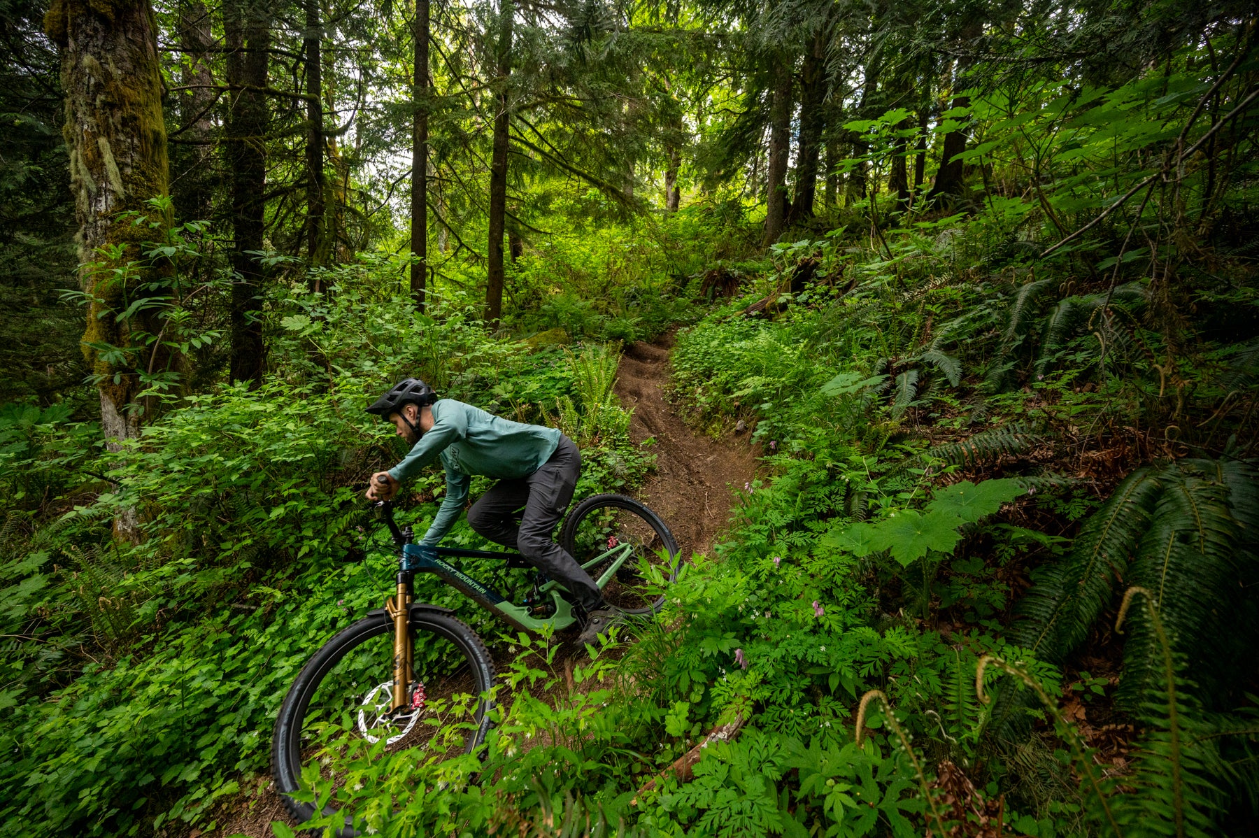 man riding bike downill with TRP EVO 12