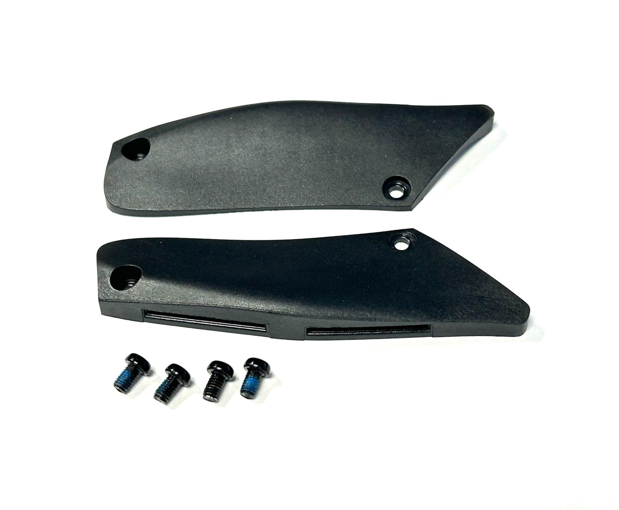 Two black plastic panels with screws on a white background