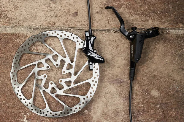 Shows TRP Trail EVO mountain bike hydraulic disc brake set for aggressive trail and enduro riding performance