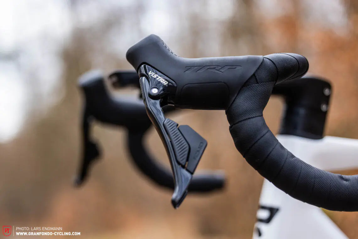 Close-up of black Vistar handlebar levers with blurred background