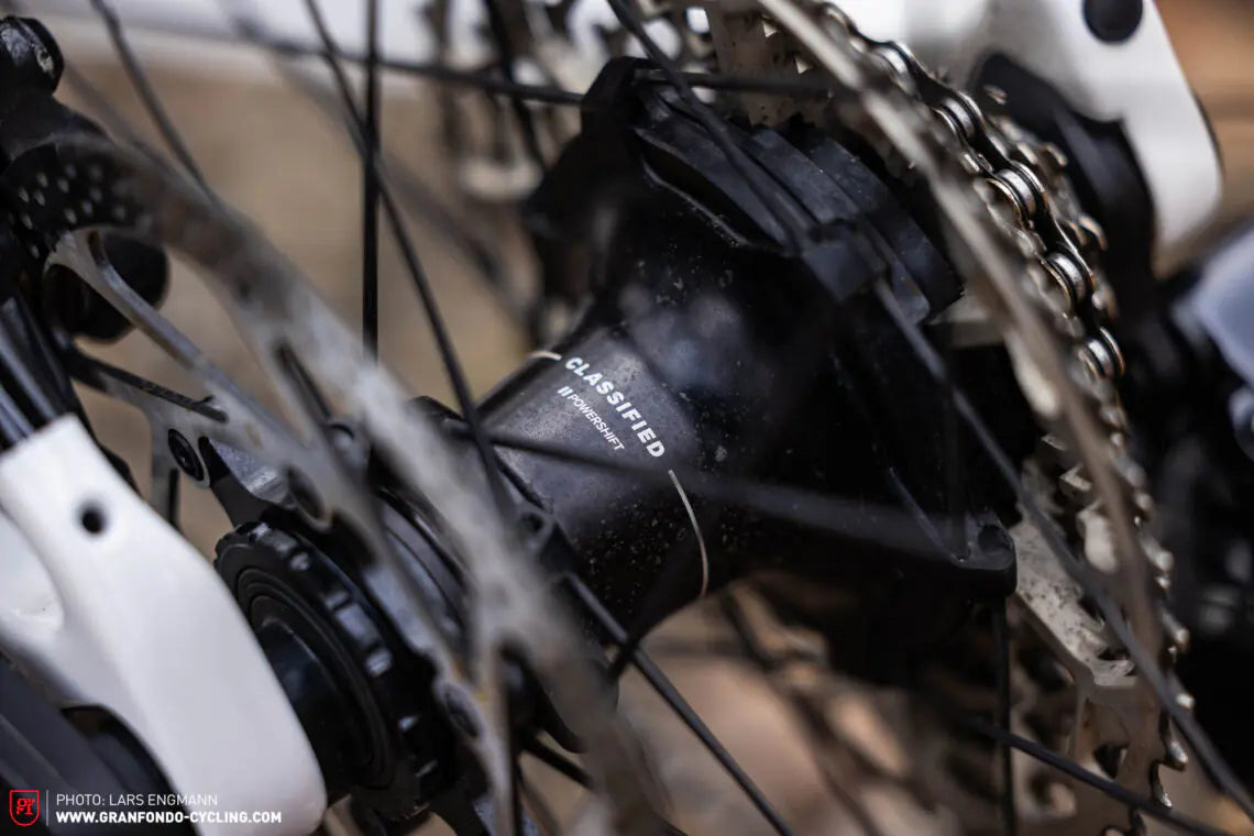 Close-up of a bicycle gear system with 'Classified' branding.